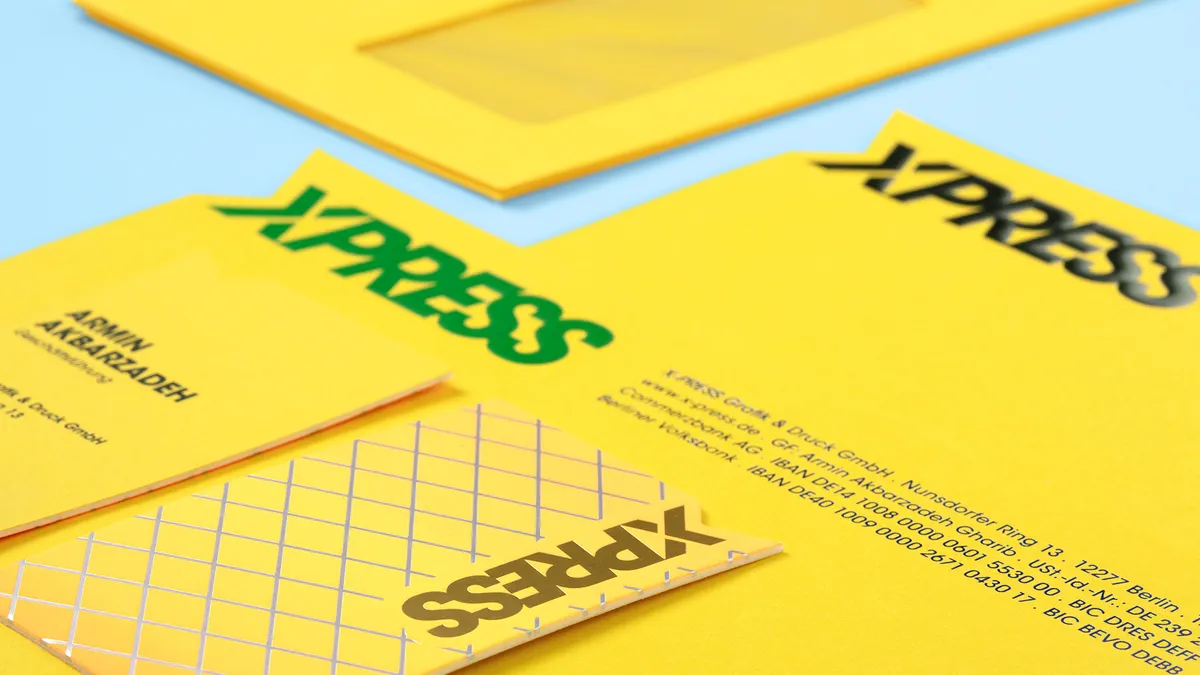 Individuelle Geschäftsausstattung von X-Press mit Visitenkarten, Briefpapier und Umschlägen auf Caribic Kanariengelb – produziert im Offsetdruck